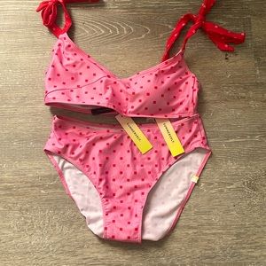 Pink square polkadotted beachy, bathing suit with red ribbon straps